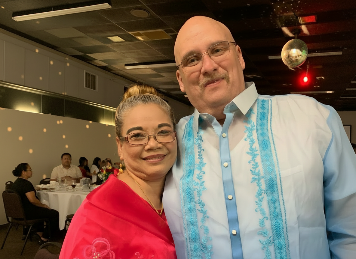 Barbie and Rich Boyd, husband and wife owners of White Buddha, smiling together at their Louisville restaurant