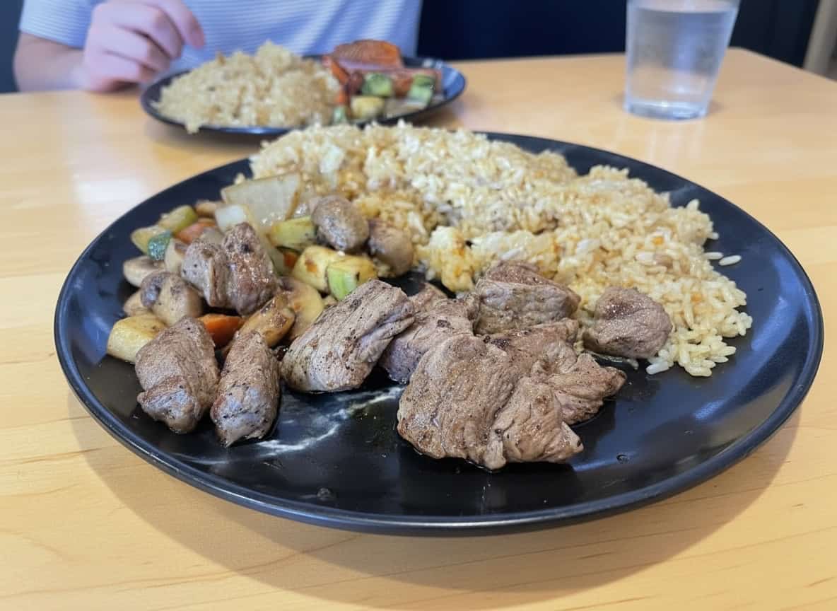 Steak hibachi with fried rice and vegetables at White Buddha Louisville.